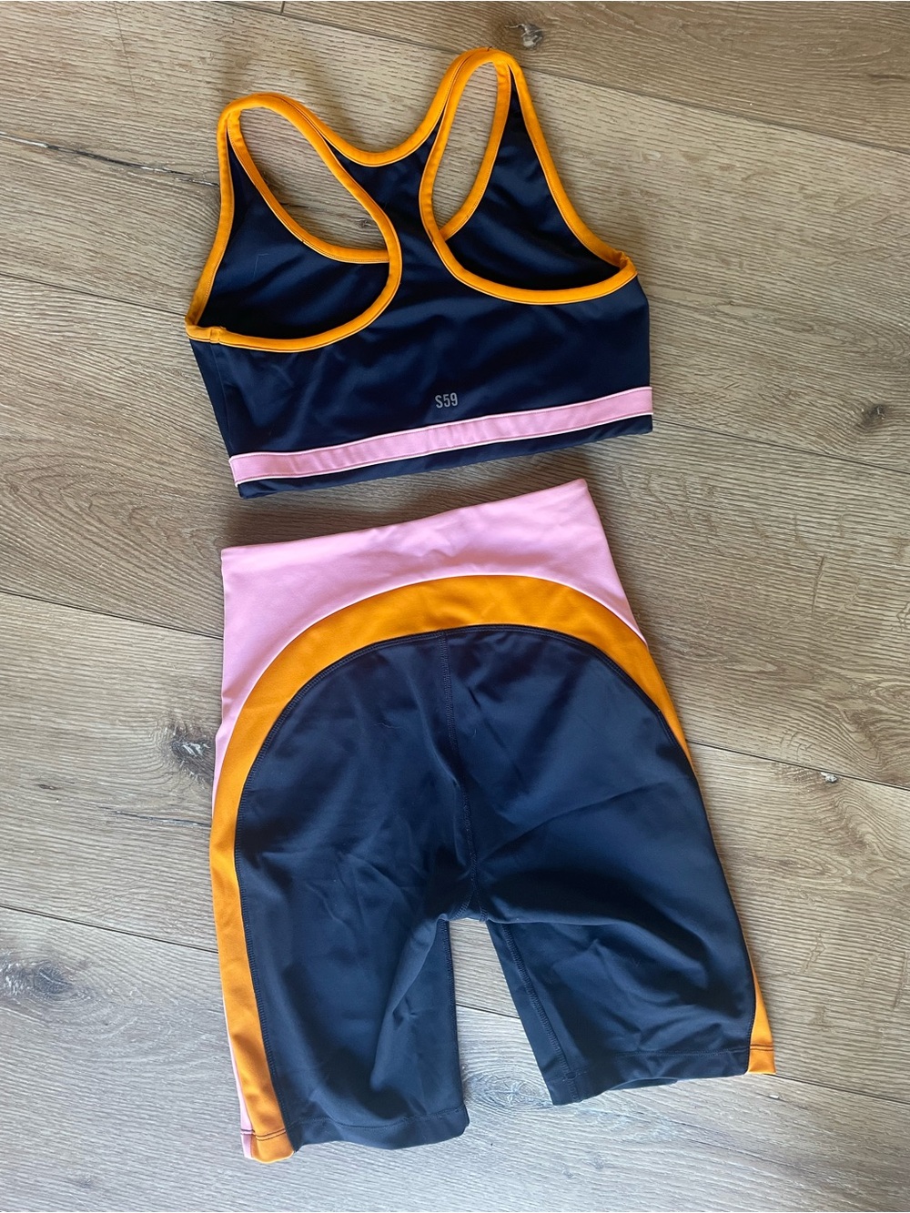 Splits59 Navy Bike Shorts & Sports Bra with Pink and Orange Trim - Picture 4 of 6